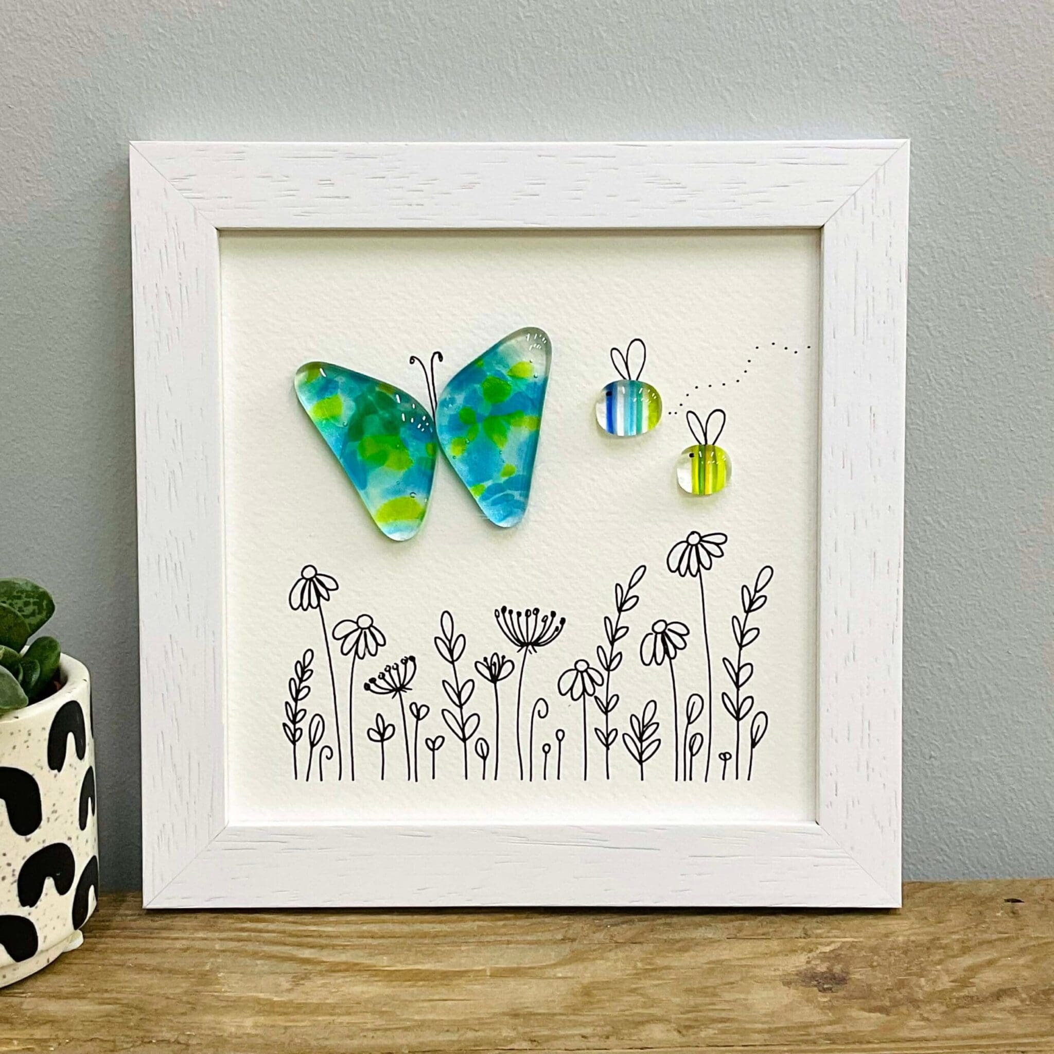 Framed fused glass butterfly and bees, greens