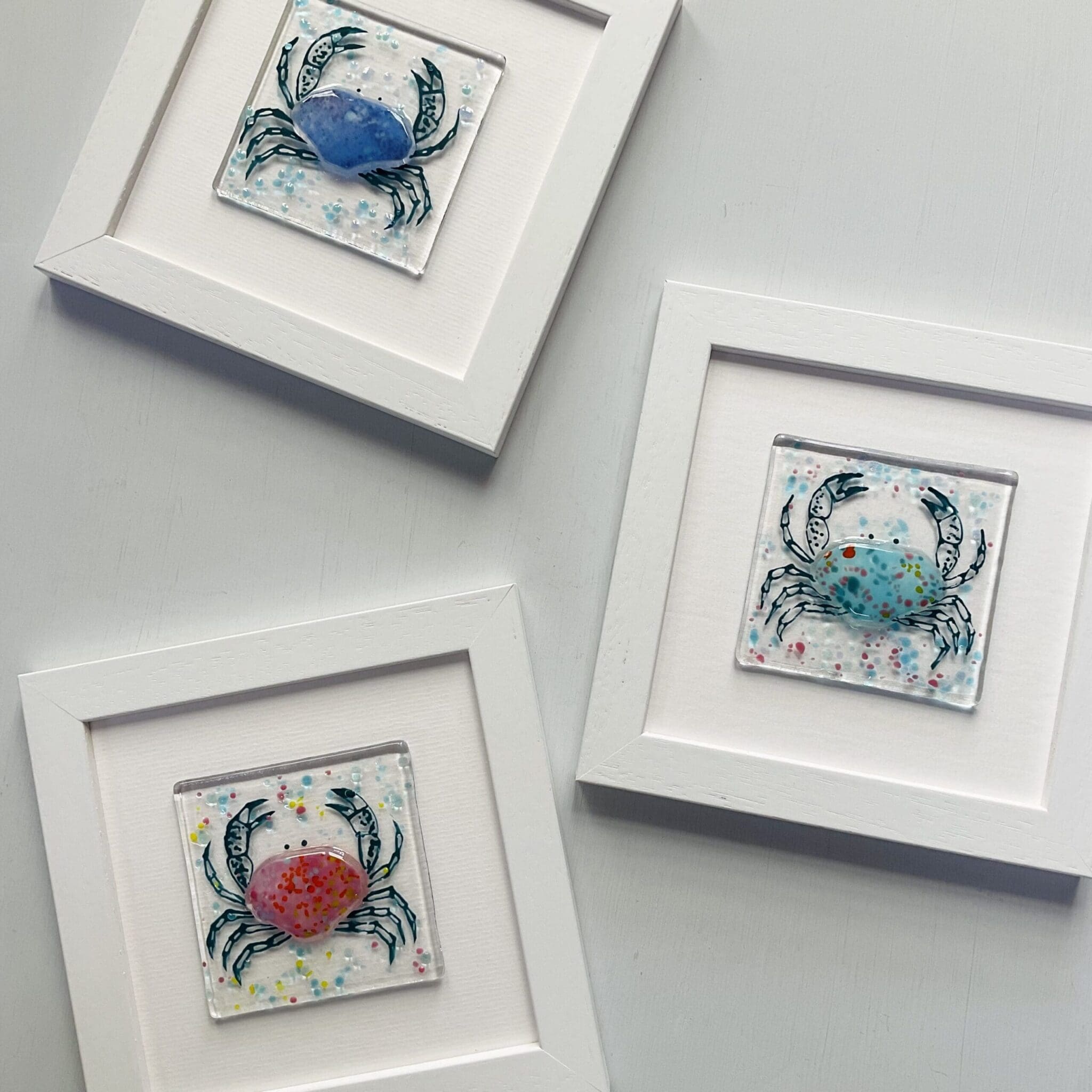 Framed fused glass crabs with glass paint