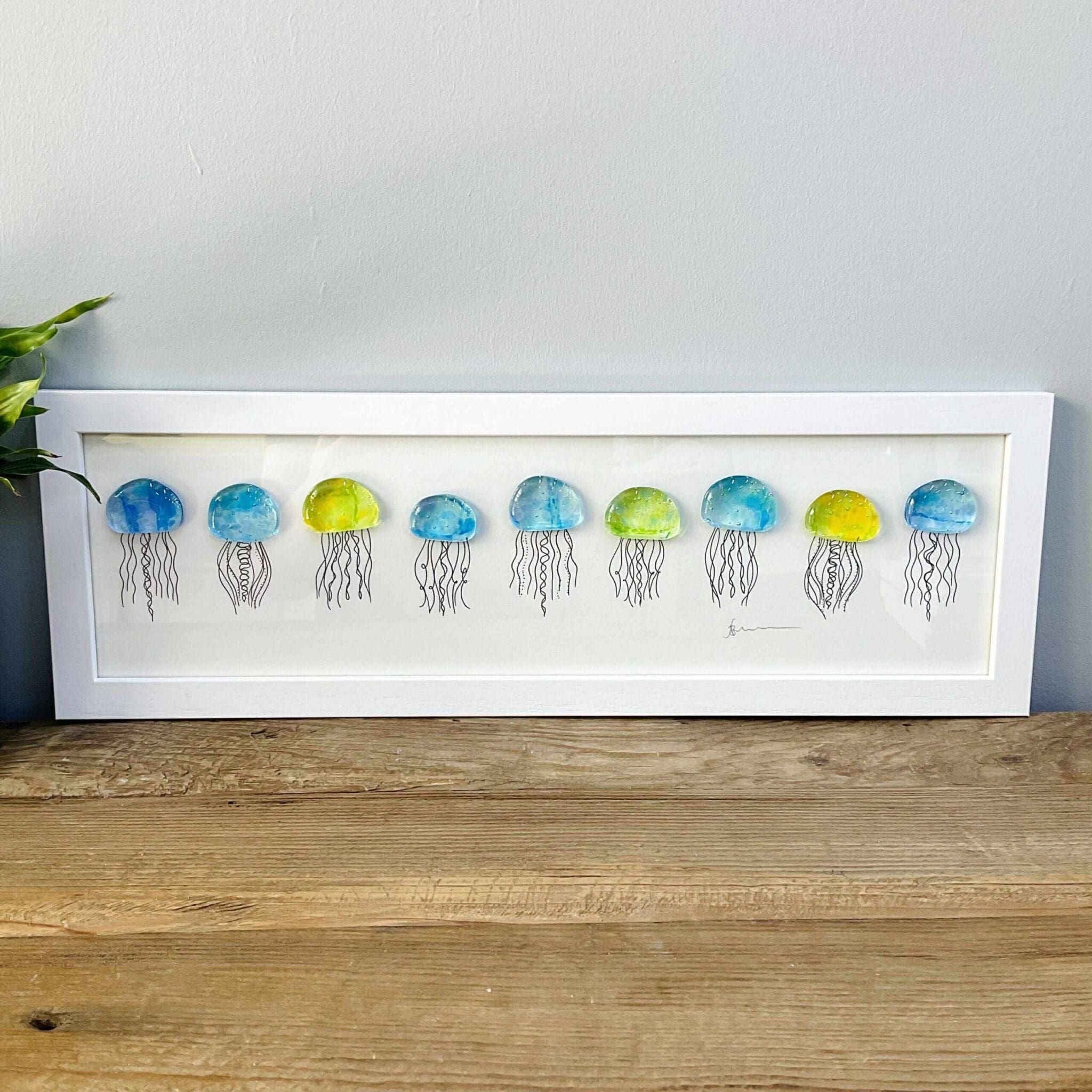 Framed fused glass jellyfish with framing glass, multi coloured
